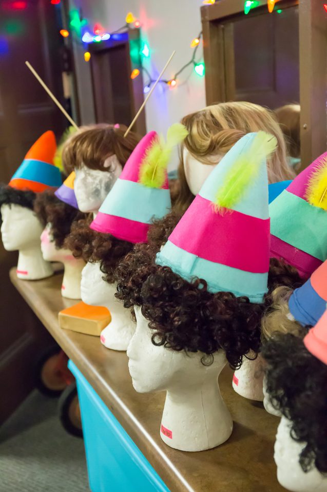 line up of elf wigs