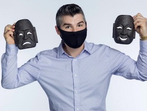 Man with comedy and tragedy theatre masks