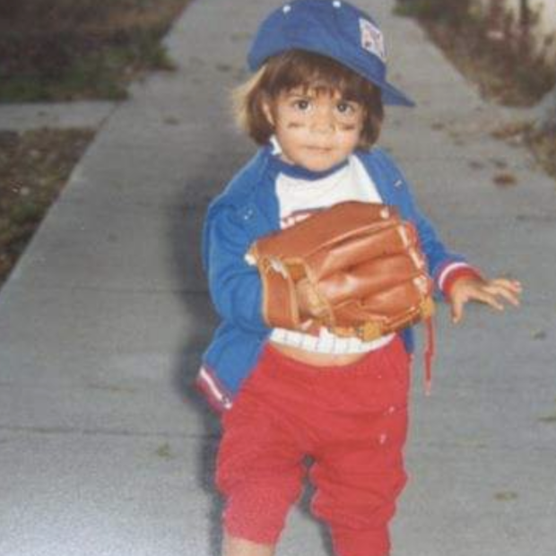 child with baseball cap and baseball glove
